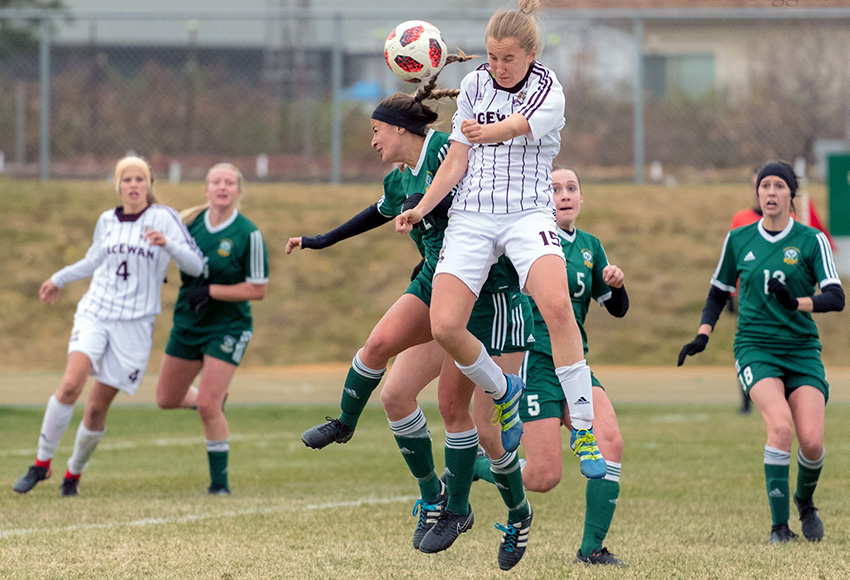 MacEwan's Maya Morrell takes to the air to battle for a ball against Alberta during their playoff match at Foote Field last fall. The Edmonton rivals will meet twice during the 2019 regular season (Chris Piggott photo).