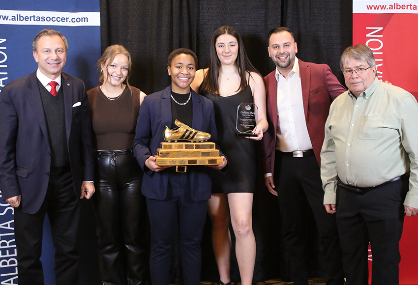 The Golden Shoe award for the Alberta Soccer Association's team of the year was presented to the Griffins in Calgary on Saturday. From left: Canadian Soccer Association president Nick Bontis, Griffins players Abbey Wright, Grace Mwasalla and Sofia DiGiacomo, head coach Dean Cordeiro and former Canada West soccer commissioner Gord Franson (Michelle Holmes, ASA photo).