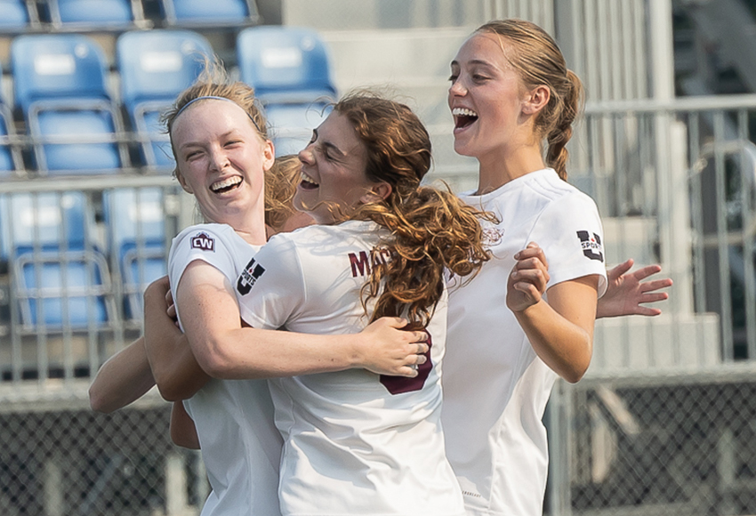 Griffins players Amelia Russo and Ella Fownes help Hannah Harper, left, celebrate after she opened the scoring in the 11th minute on Saturday (Rebecca Chelmick photo).