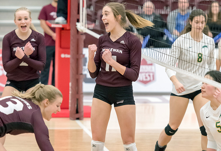 McKenna Stevenson celebrates a point with teammates during a match against Regina last month. The middle is coming off a 10-block game against Brandon and will be relied on heavily again against Calgary this weekend (Chris Piggott photo).