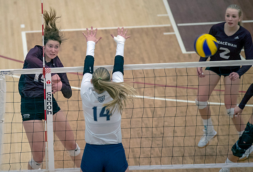 Tess Pearman hits the ball past MRU's block during a match last weekend. The Griffins will travel to Regina for Friday and Saturday contests this week (Eduardo Perez photo).