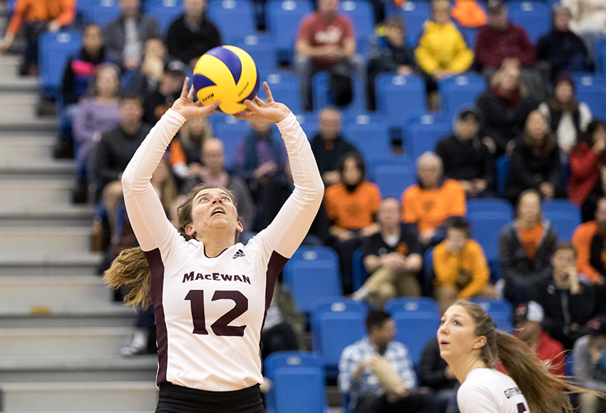 Kylie Schubert sets the ball against Thompson Rivers on Saturday night. She had 46 assists for MacEwan in a 3-2 defeat (Andrew Snucins photo).