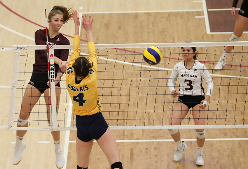 Haley Gilfillan blasts a ball past Brandon's Ravyn Wiebe on Saturday. She finished with nine kills, six aces and five blocks to lead the Griffins to a 3-2 win (Eduardo Perez photo).