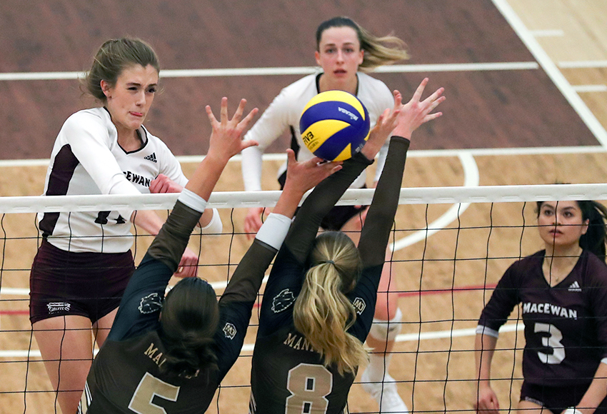 Mckenna Stevenson blasts a ball through the Manitoba block in MacEwan's final weekend of action in the first semester. The Griffins resume the second half of the season in Saskatoon this weekend (Eduardo Perez photo).
