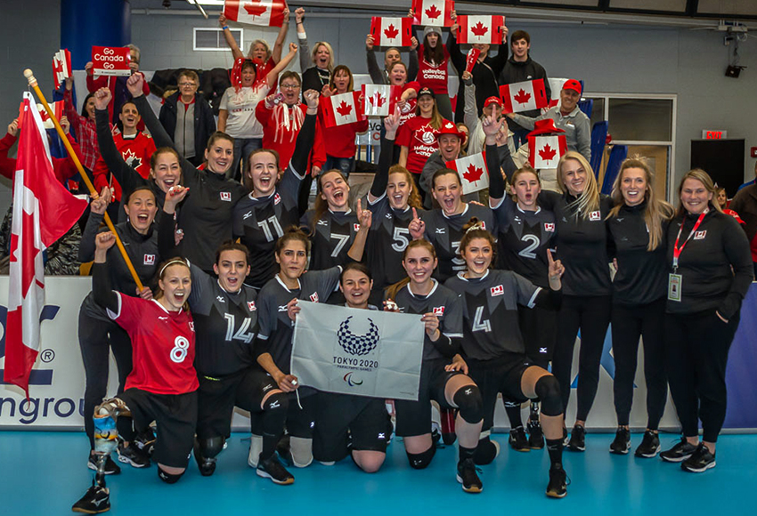 The Canadian women's sitting volleyball team under head coach Nicole Ban (back row third from left) celebrates after qualifying for the Tokyo Paralympics in March 2020 (Photo courtesy of Nicole Ban).