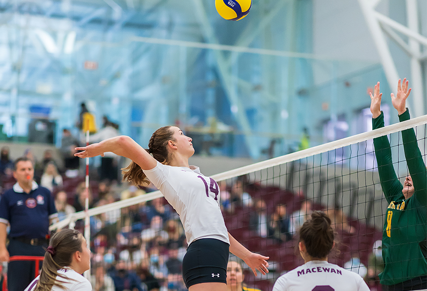 Sarah McGee goes up for a smash against Alberta during MacEwan's home opener on Nov. 5. The teams will meet again this weekend at the Saville Centre (Robert Antoniuk photo).