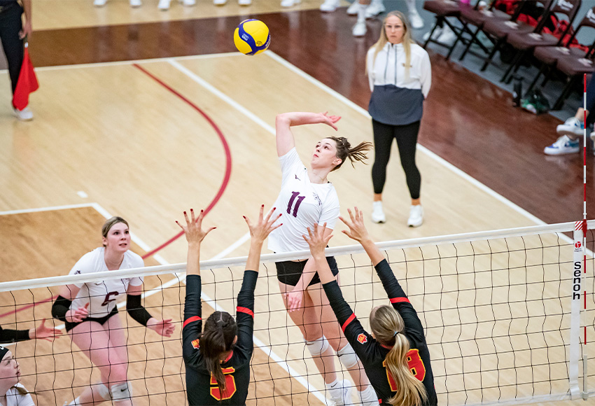 Andi Krawec goes up for a kill during Friday action against the Dinos (Eduardo Perez photo).