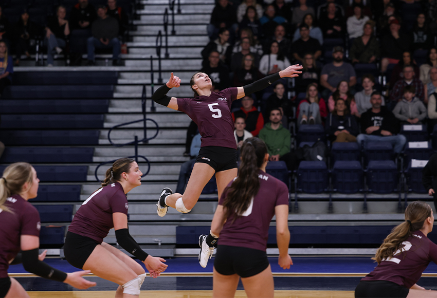 Mariah Bereziuk soars through the air hunting for a kill against Trinity Western on Friday. She turned up the heat in Saturday's match with a program record-matching 25 kills and program record 28.0 points (Mark Janzen photo).