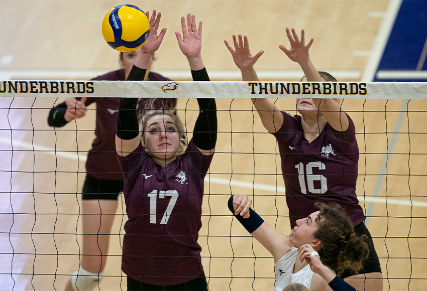 Alyshia Bryks and Evangeline Zeyha put up a block against UBC on Friday (Rich Lam photo).