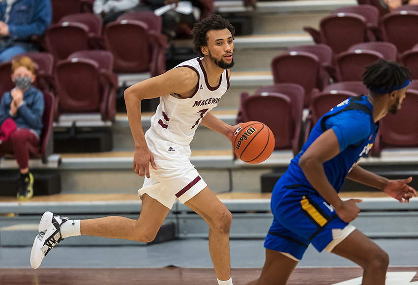 Josh Edwards dribbles the ball up the court against UBC-Okanagan on Friday night. The Griffins earned a weekend split in their preseason home-opening weekend (Robert Antoniuk photo).