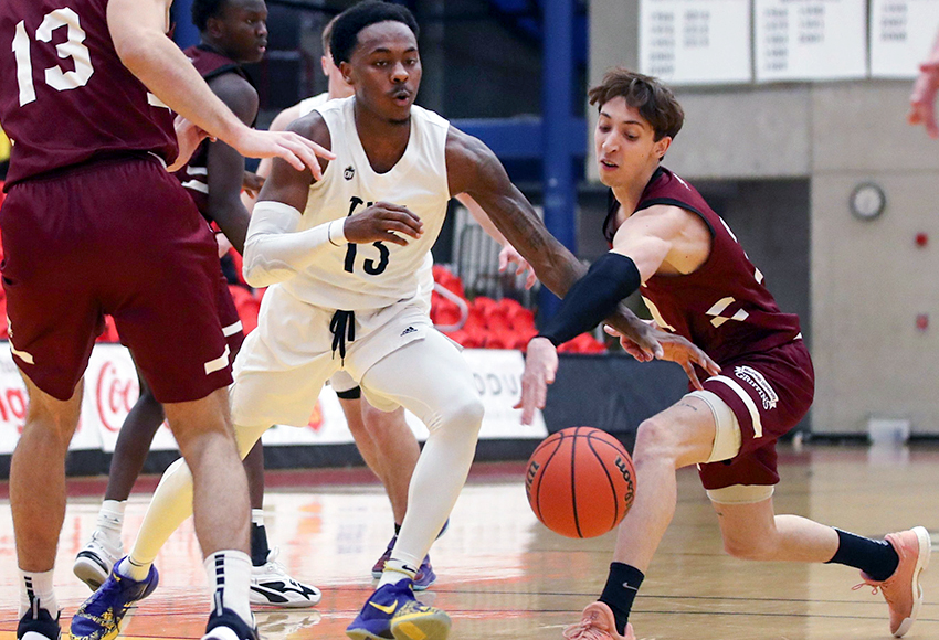 Eric Lopez disrupts Trinity Western's Ja'Qualyn Gilbreath's momentum on a play Thursday night, but the Griffins couldn't do much to stop him and his backcourt mate Mason Bourcier, who both posted triple-doubles for TWU (David Moll, Dinos Athletics).