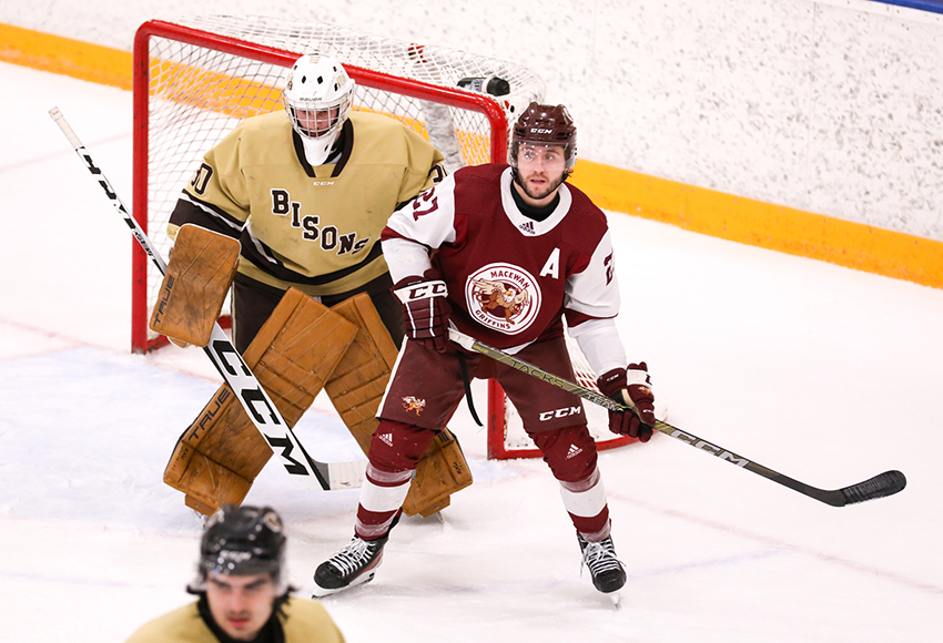 Marc Pasemko parks in front of Manitoba goaltender Kolby Thornton on Saturday (Dave Mahussier photo).