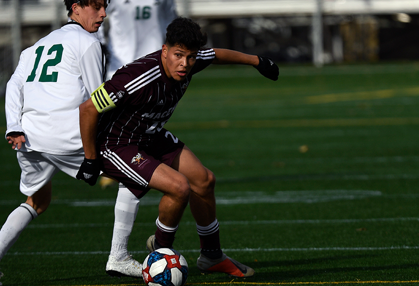 Wearing the captain's armband, Jose Cruz plays a ball in midfield on Sunday in the final game of his university career (Chris Piggott photo).