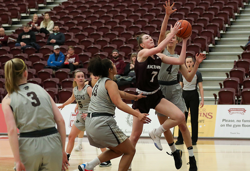 Mackenzie Farmer drives to the hoop through the Manitoba defence on Saturday night. She had a game-high 25 points but the Griffins fell short 94-76 (Eduardo Perez photo).