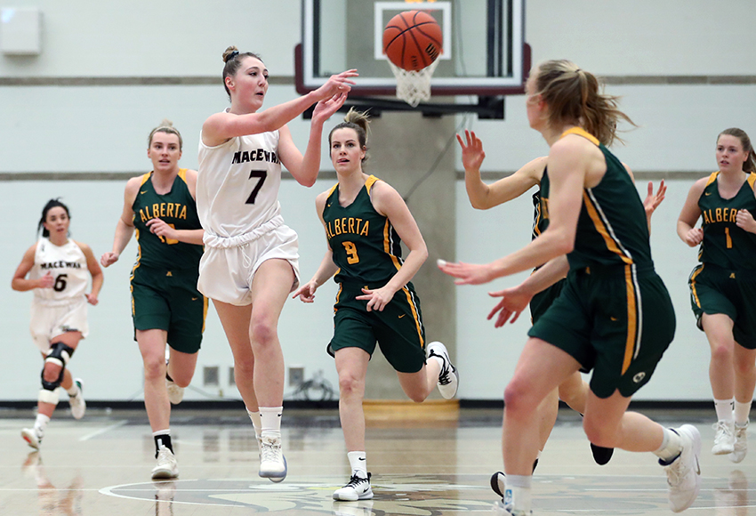 Mackenzie Farmer passes the ball during Thursday's game against Alberta at the David Atkinson Gym. She led the team will 11 points in Saturday's rematch at the Saville Centre (Eduardo Perez photo).