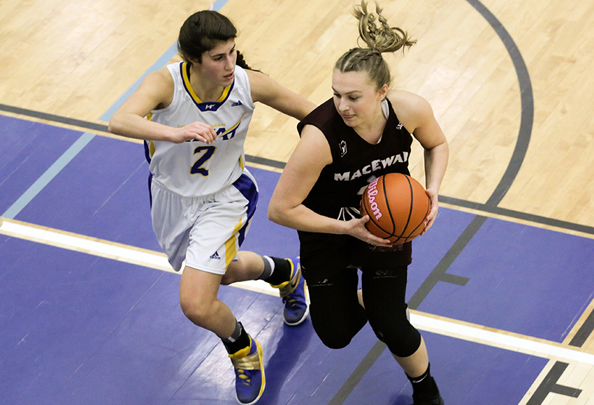 Rachel Hare drives to the basket during a game against UBC-Okanagan last season. She;s one of four players from Kelowna on the Griffins' roster (Cary Mellon, UBCO photo).