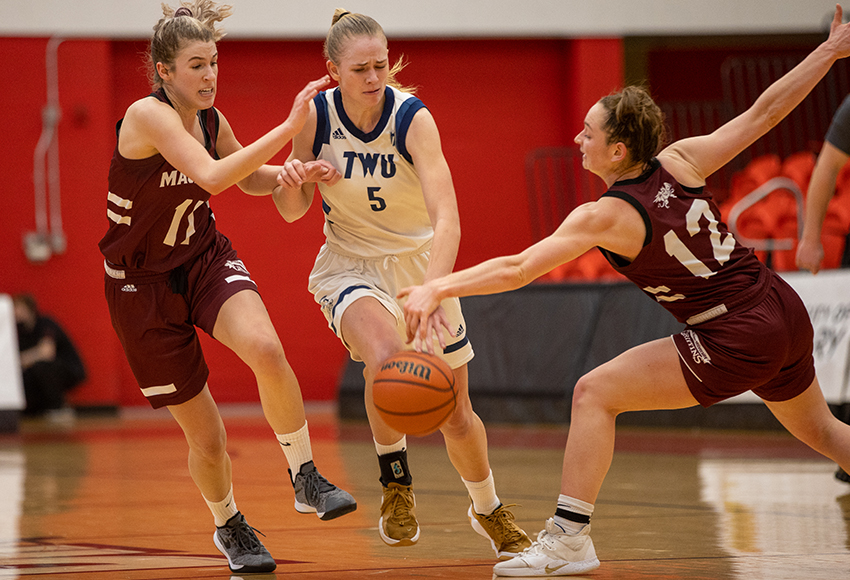 Noelle Kilbreath steals the ball away from Jolene Vlieg on Saturday. Kilbreath led the Griffins with 29 points (Chris Lindsey, Dinos Athletics).