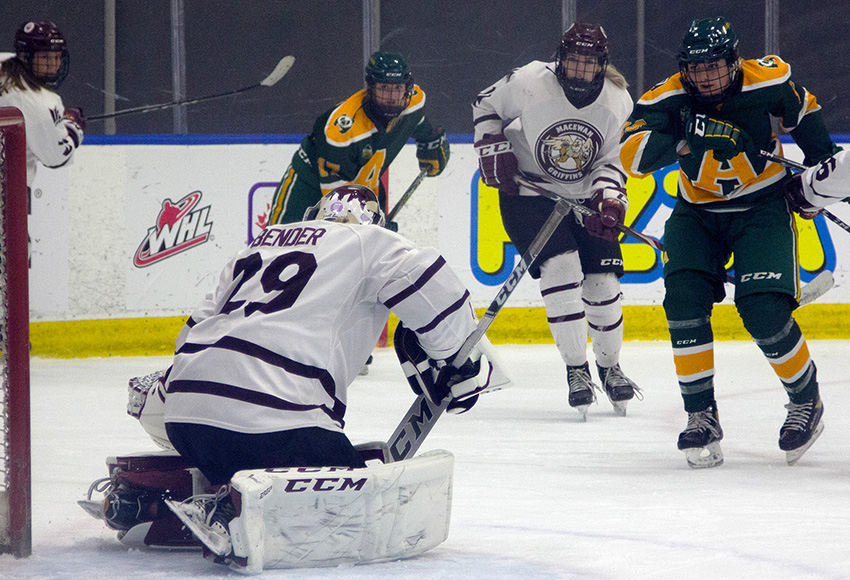 Natalie Bender makes one of her 28 saves against the Pandas on Friday night (Jaelyn Birch photo).