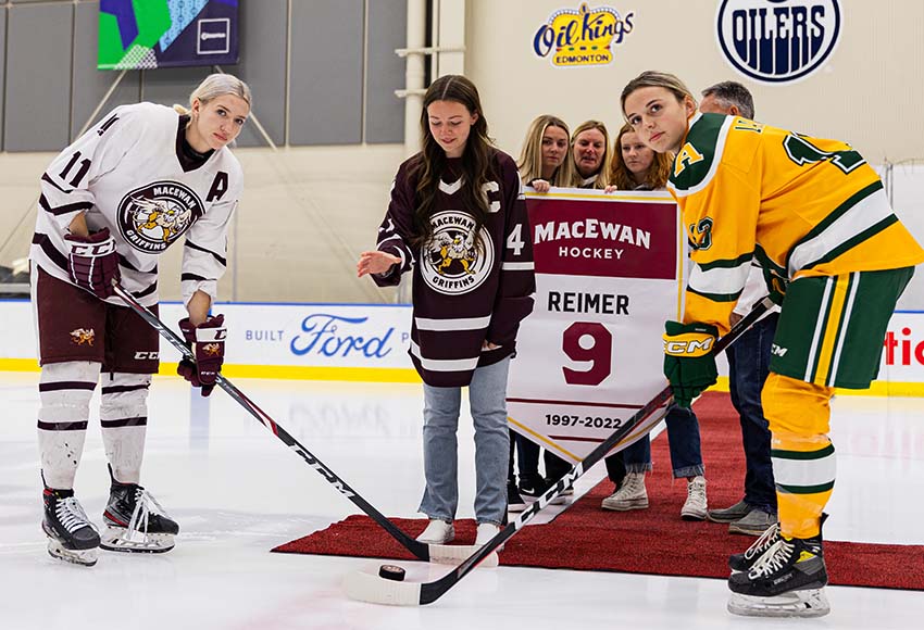 Former Griffins captain Nikki Reimer drops the puck on a ceremonial pre-game face-off honouring her sister and fellow former Griffin Jordyn Reimer, who was killed in a car crash last May (Joel Kingston photo).