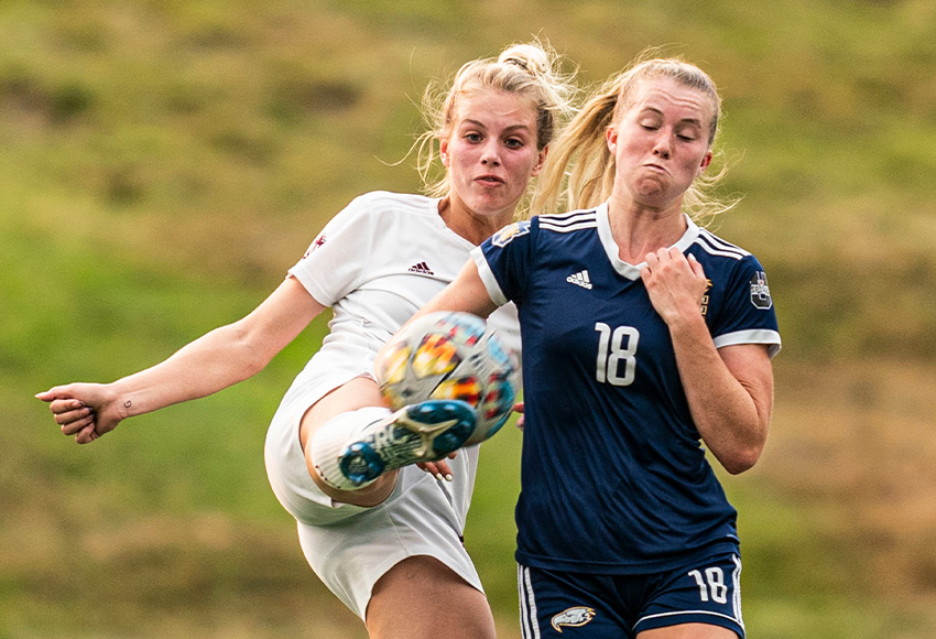 Alyx Henderson goes against UBC's Ella Sunde in a match at Thunderbird Stadium last September. The last two undefeated teams in Canada West will meet on Friday (Rich Lam, UBC Athletics).