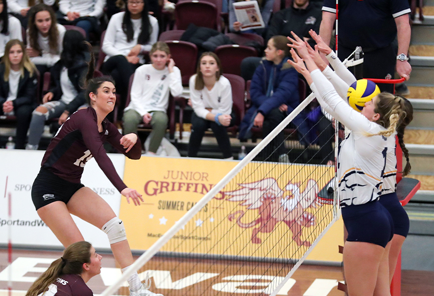 Lauren Holmes crushes one through a double UBC block - one of her match-high 13 kills for the Griffins in a 3-1 win on Saturday (Eduardo Perez photo).