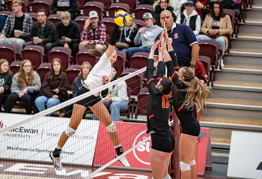 Mariah Bereziuk attacks against the Calgary Dinos in a match last Friday. MacEwan took it to five sets, showing glimpses of their potential before falling 3-2 (Eduardo Perez photo).